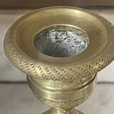 Pair of chiselled brass candlesticks from the 19th century.