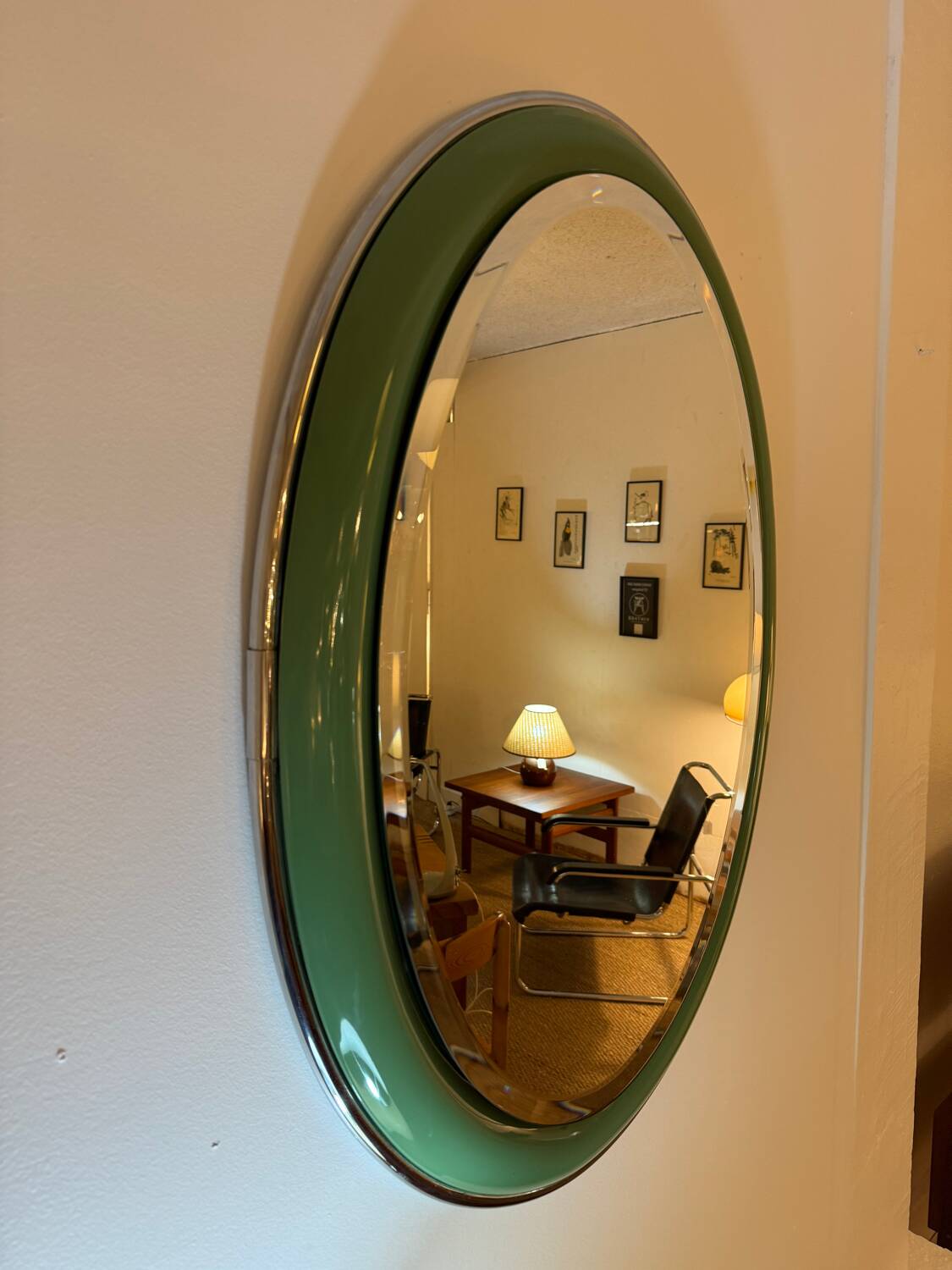 Vintage oval mirror with English green lacquered curved frame and chrome surround