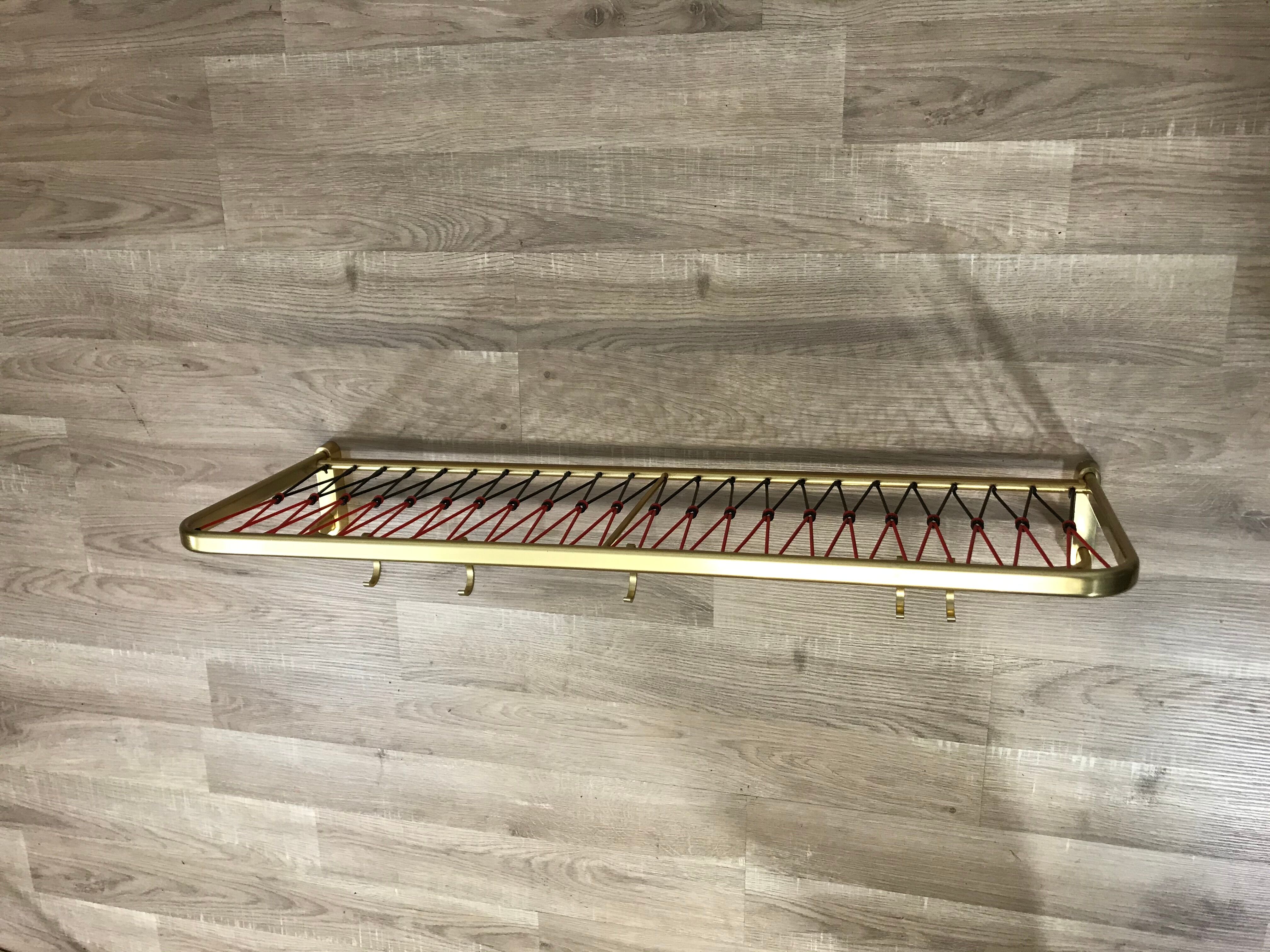 Coat rack with scoubidou shelf
