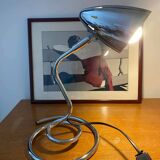 Chrome table lamp with spiral base and adjustable head. Halo brand