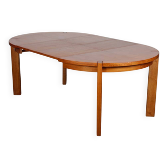 Round extendable dining table made of wood, published by Monopoly, 1970.