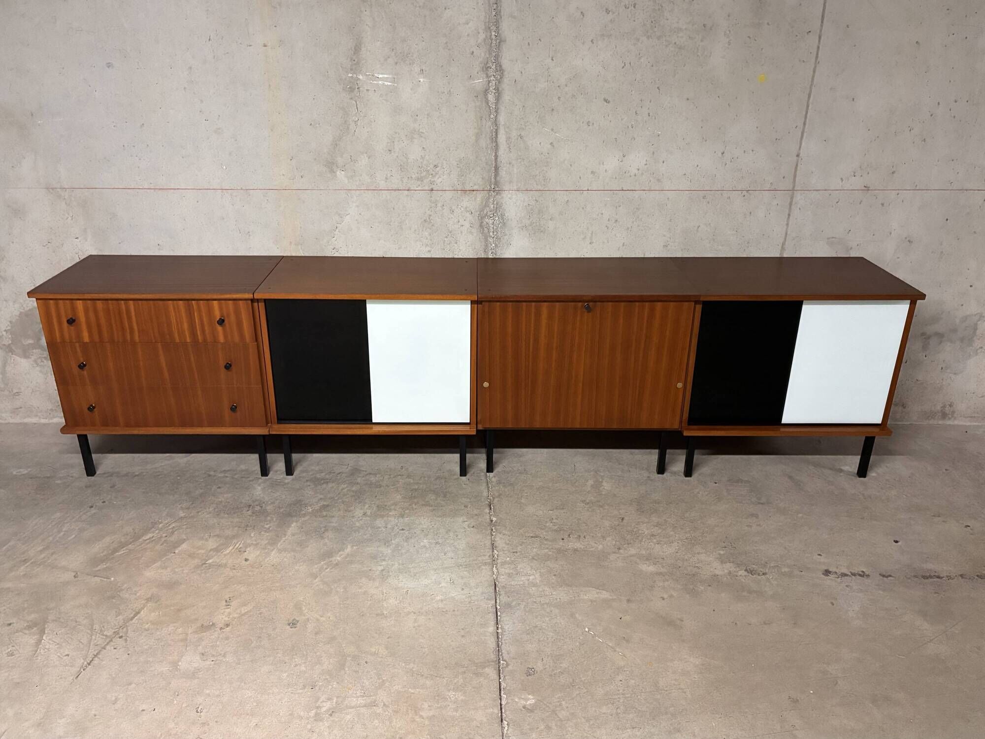 Enfilade buffet display cabinet in vintage 1950s style.