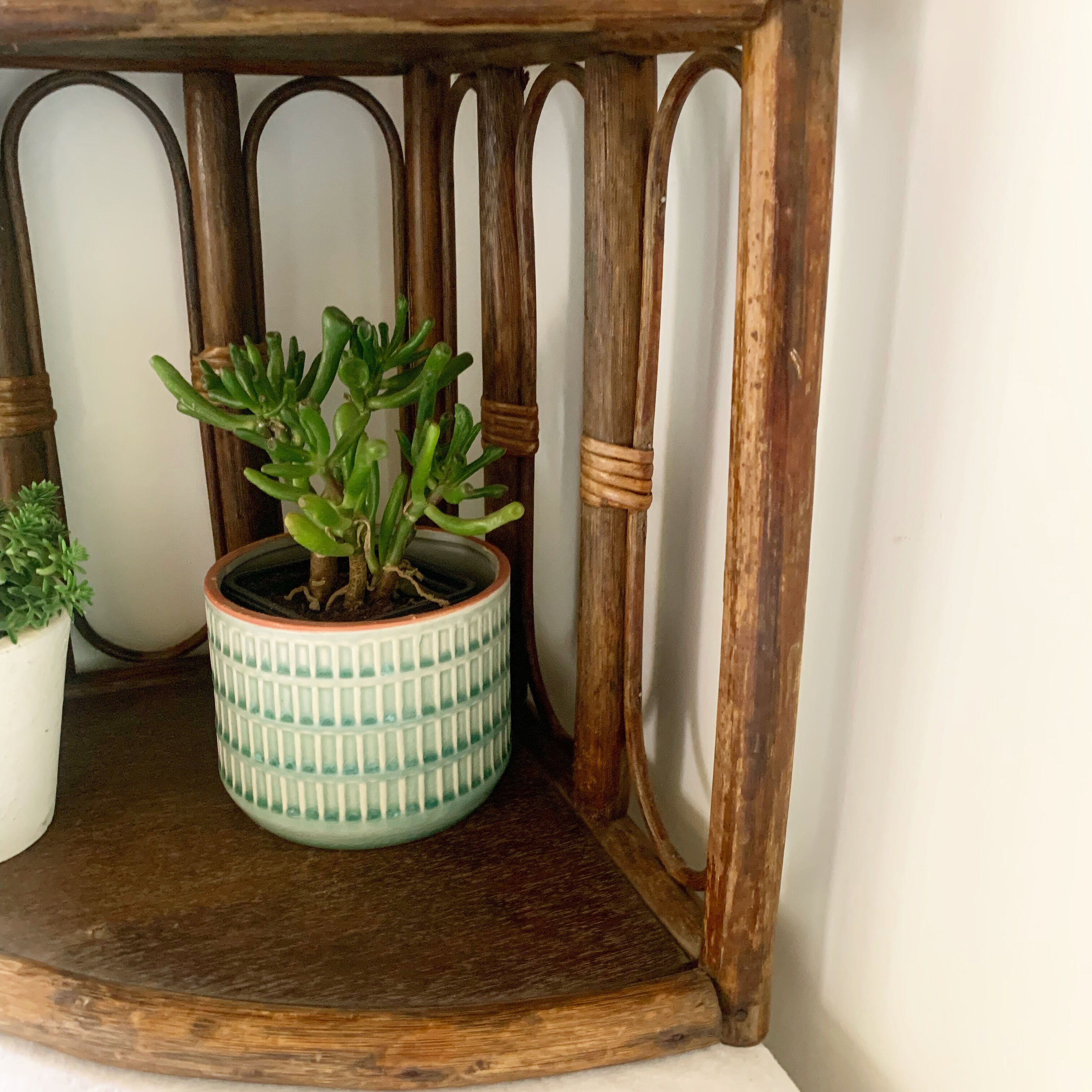 Rattan corner shelf