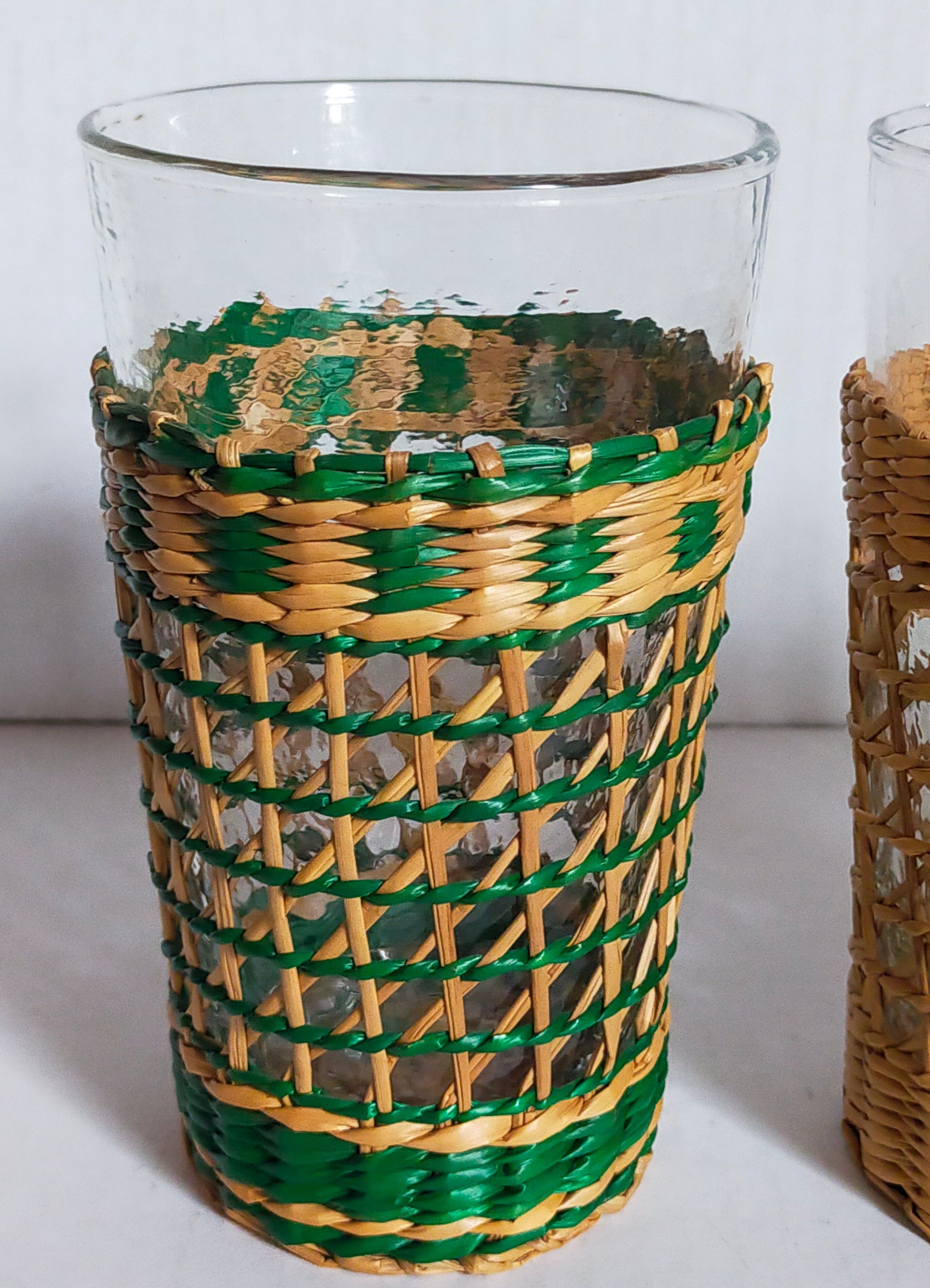 Four long drink glasses in vintage woven rattan cases