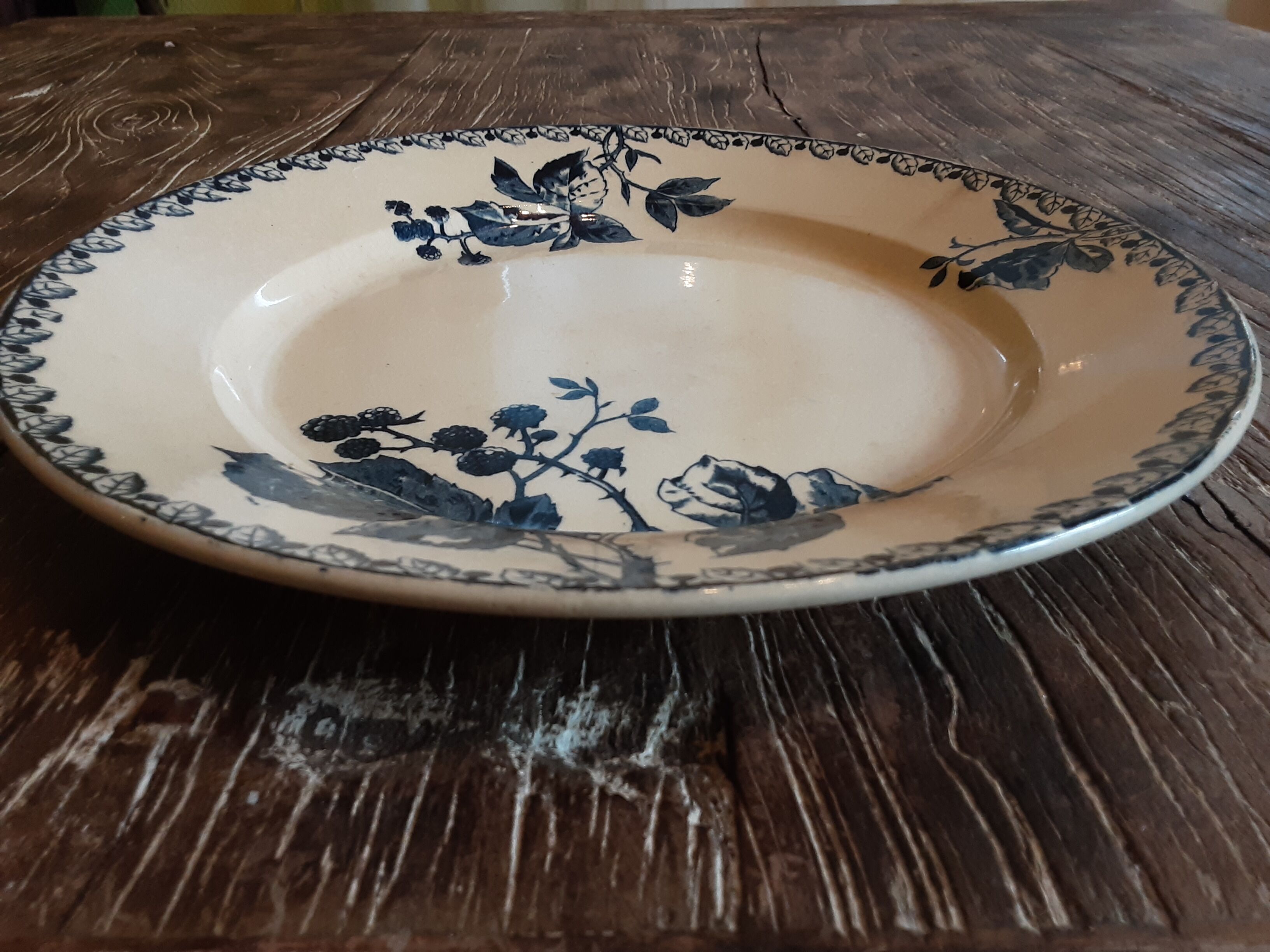 Ancient round iron earth dish