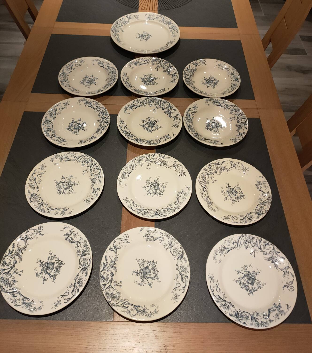 Service of old Gien earthenware plates and dishes