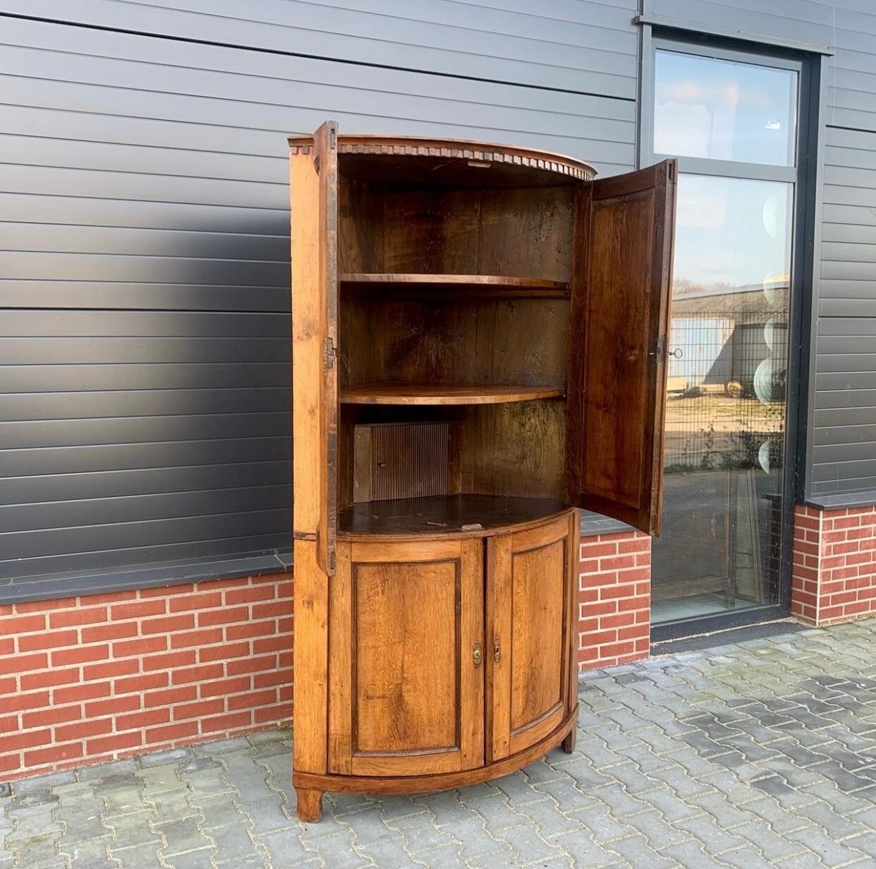 Louis Seize Oak corner cabinet with a quarter curved front