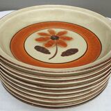 Set 11 plates 1970 Revernay Sarreguemines orange and brown on sandstone background
