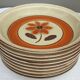 Set 11 plates 1970 Revernay Sarreguemines orange and brown on sandstone background