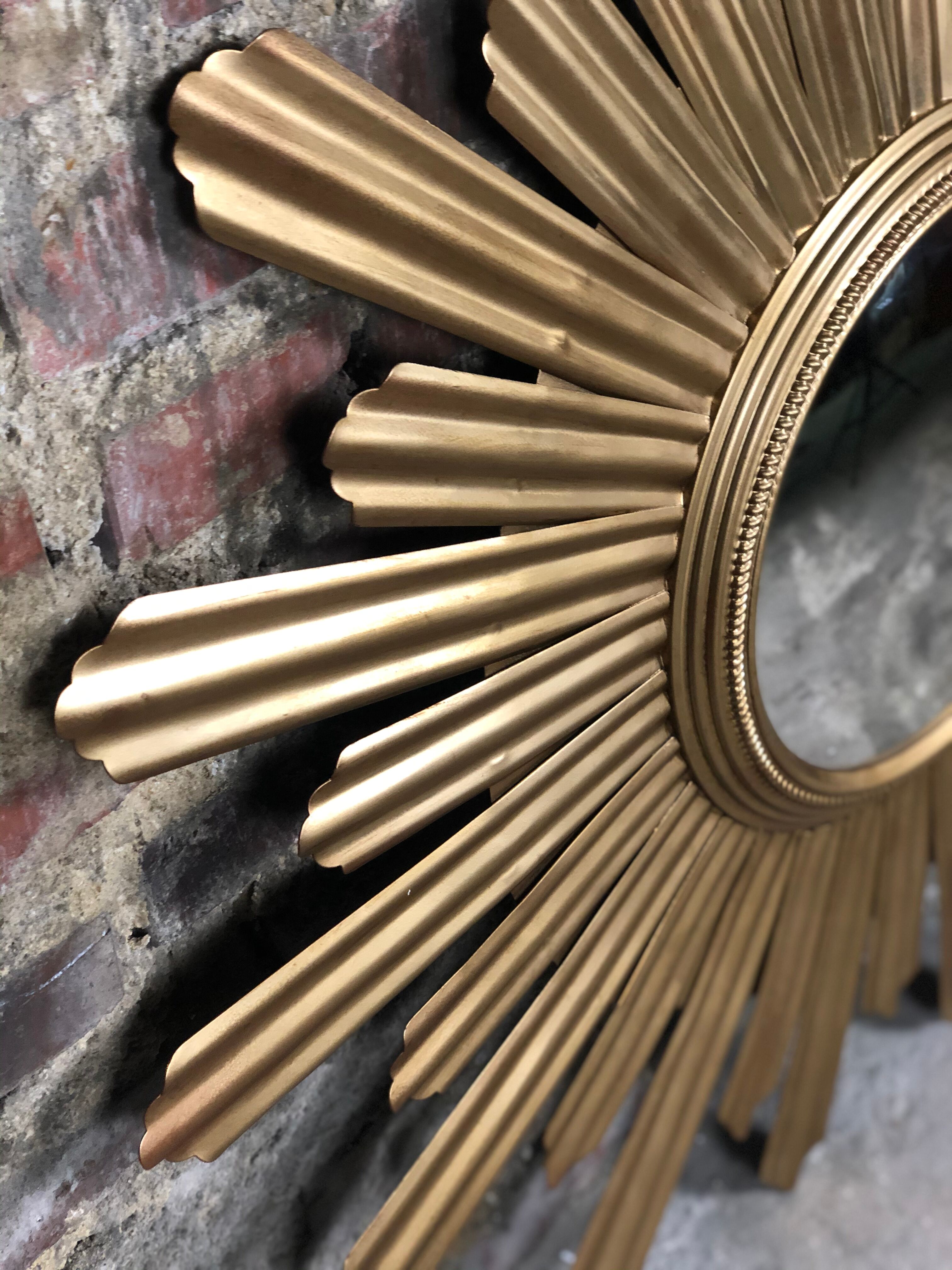 Sun mirror "André" in gilded sheet metal witch eye