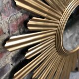 Sun mirror "André" in gilded sheet metal witch eye