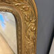 Golden mirror with mouldings