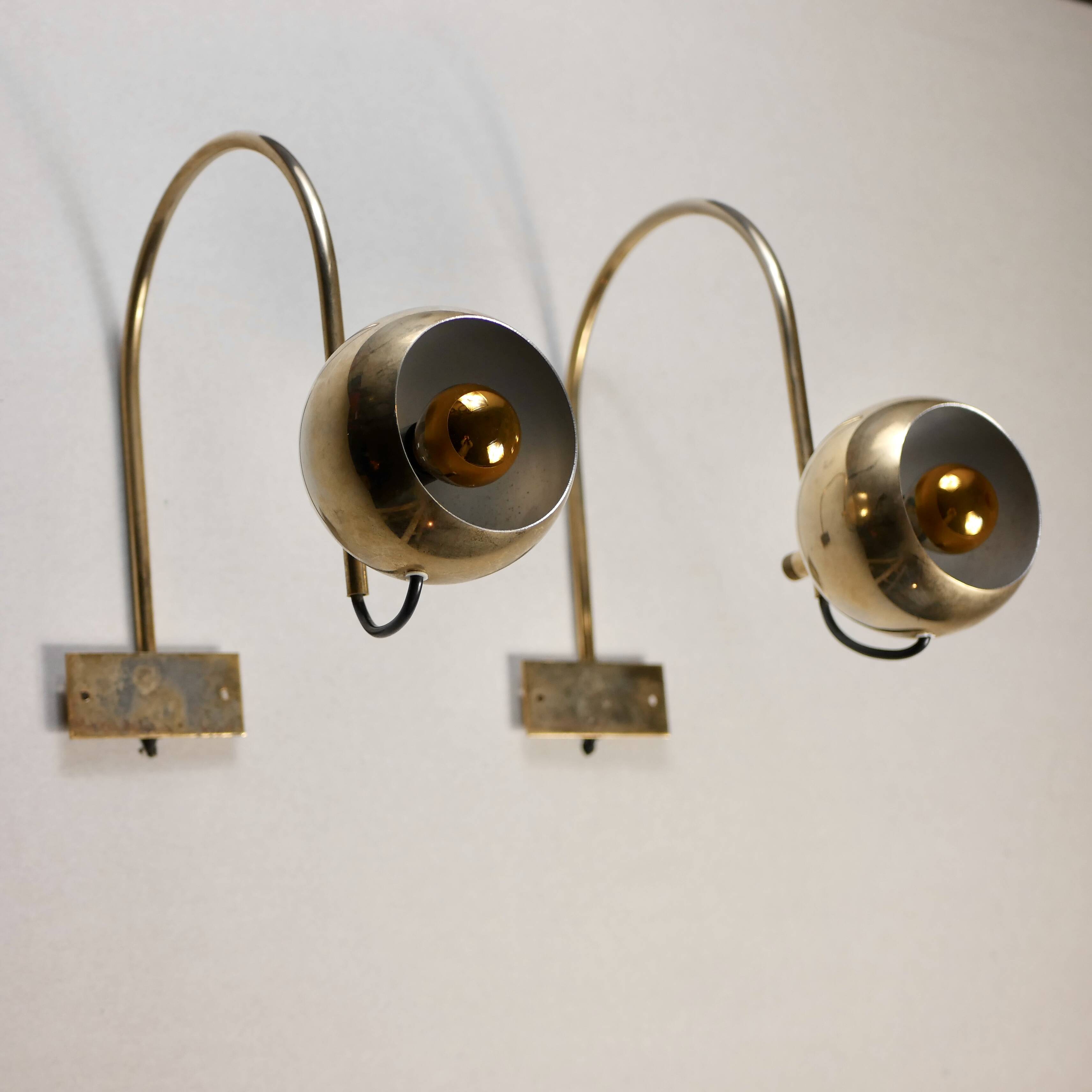Pair of brass eyeball wall lights