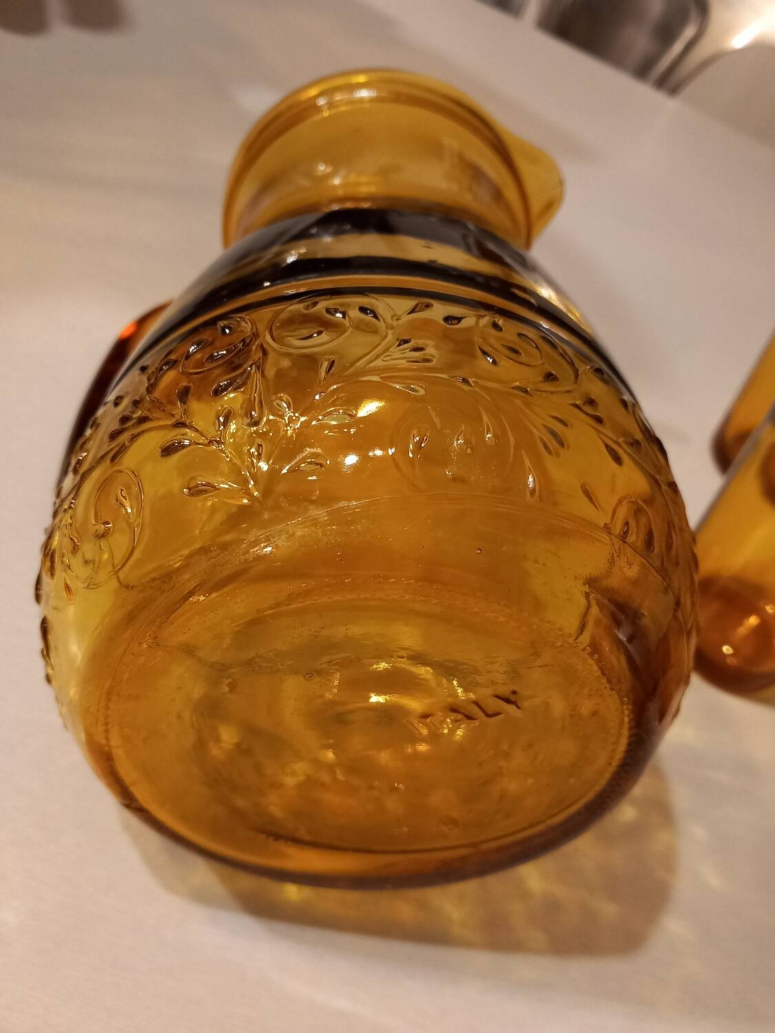 Italian pitcher service and 6 amber glasses