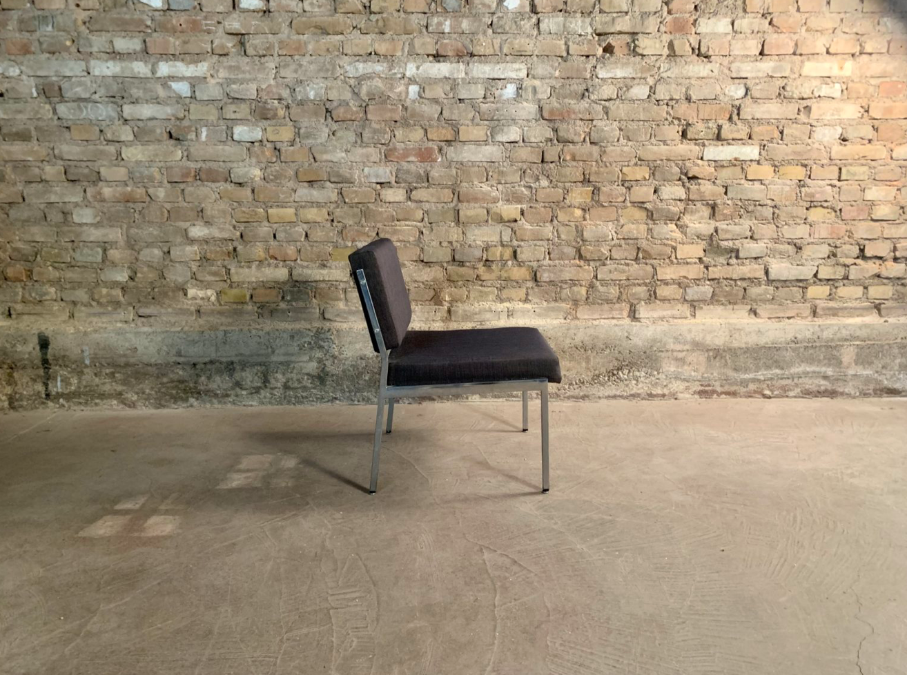 Armchair in metal and grey fabric