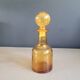 Amber molded glass carafe with stopper