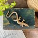 Small brass lizard