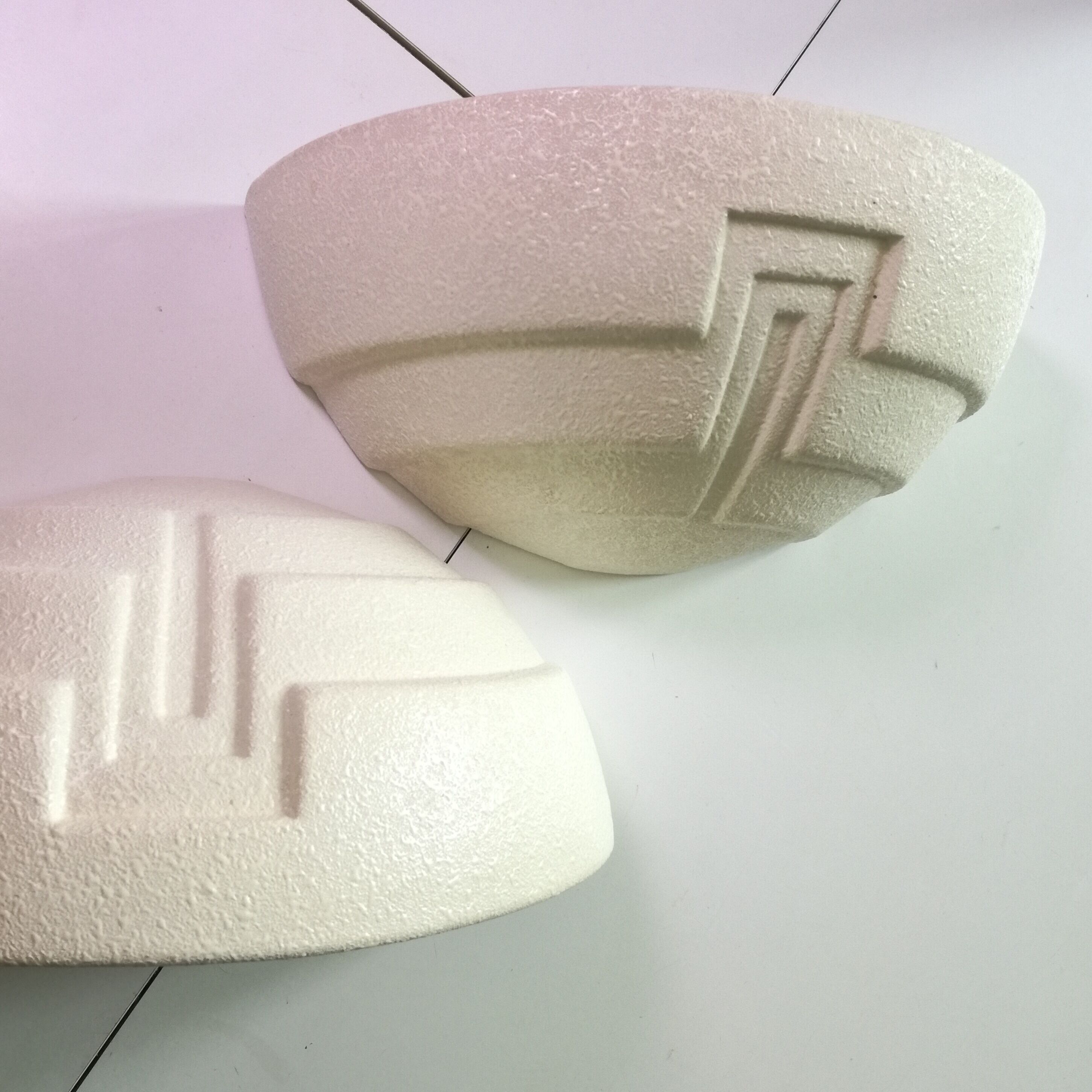 Wall sconces in stone and in the shape of a basin