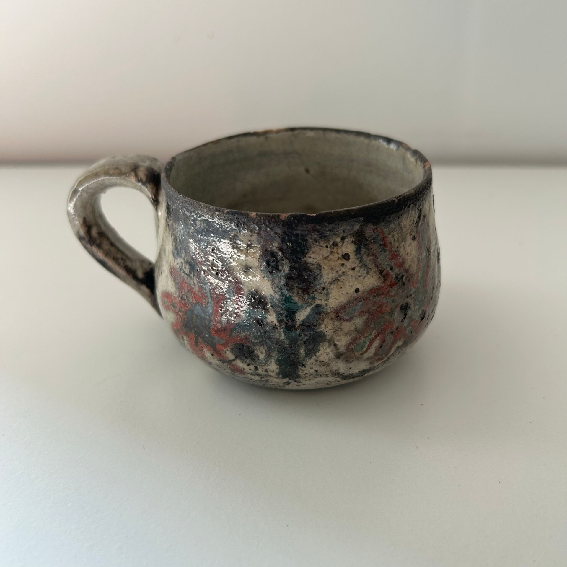 Handcrafted mug with floral decoration