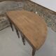 Half-moon extendable oak table for 2 to 8 people.