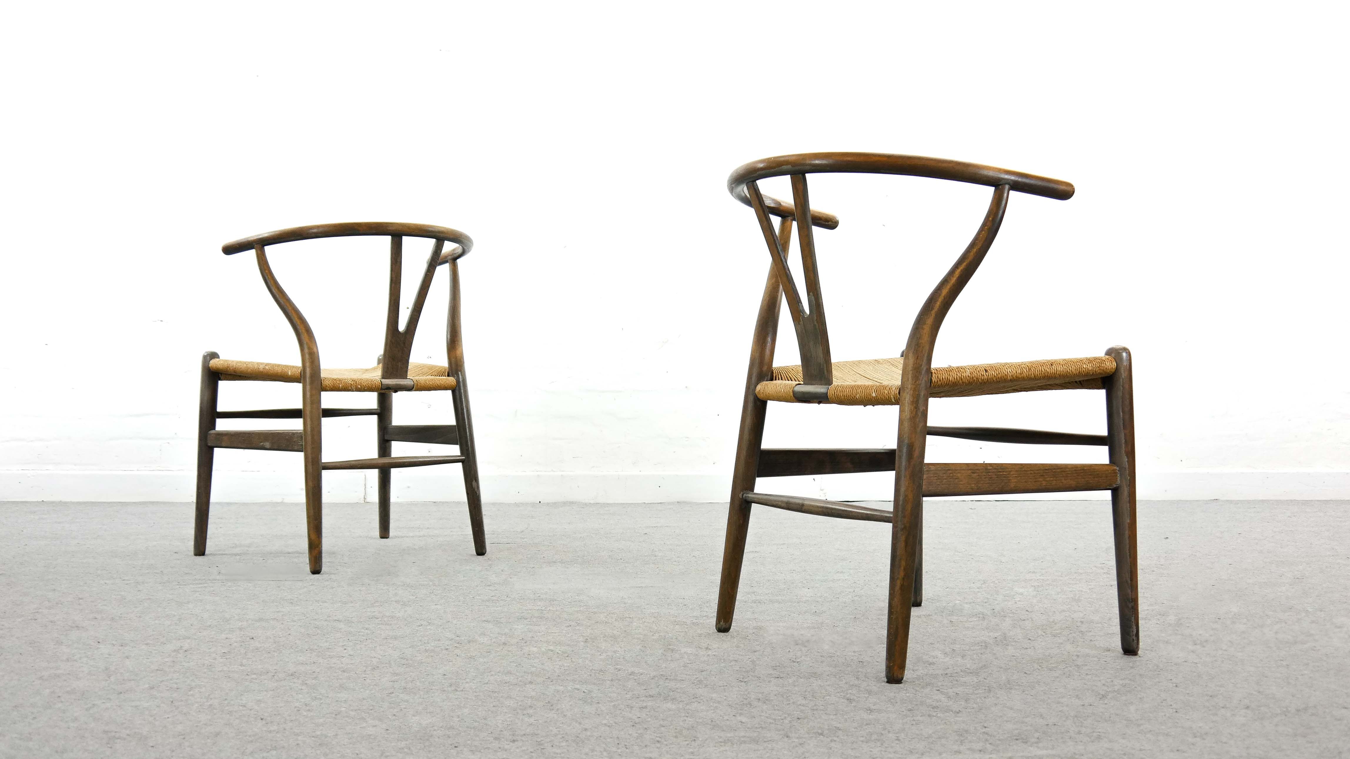 Pair of CH24 wishbone dining chairs by Hans Wegner for Carl Hansen Denmark