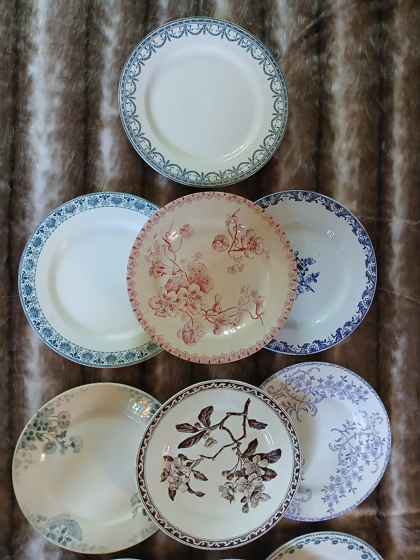 13 mismatched flat plates in ironstone