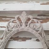 Oval frame molding patinated plant decoration