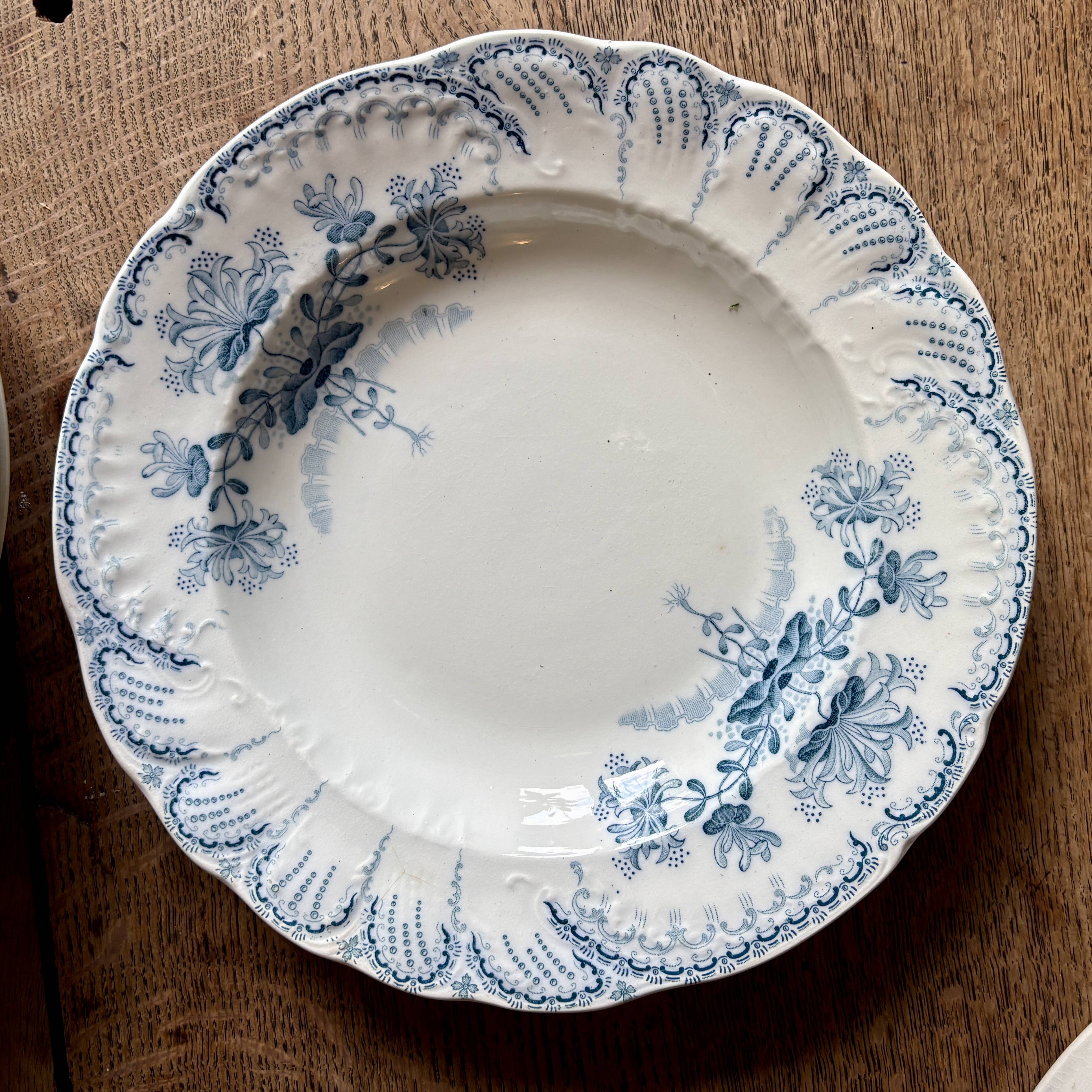 Set of 8 mismatched antique ironstone deep plates.