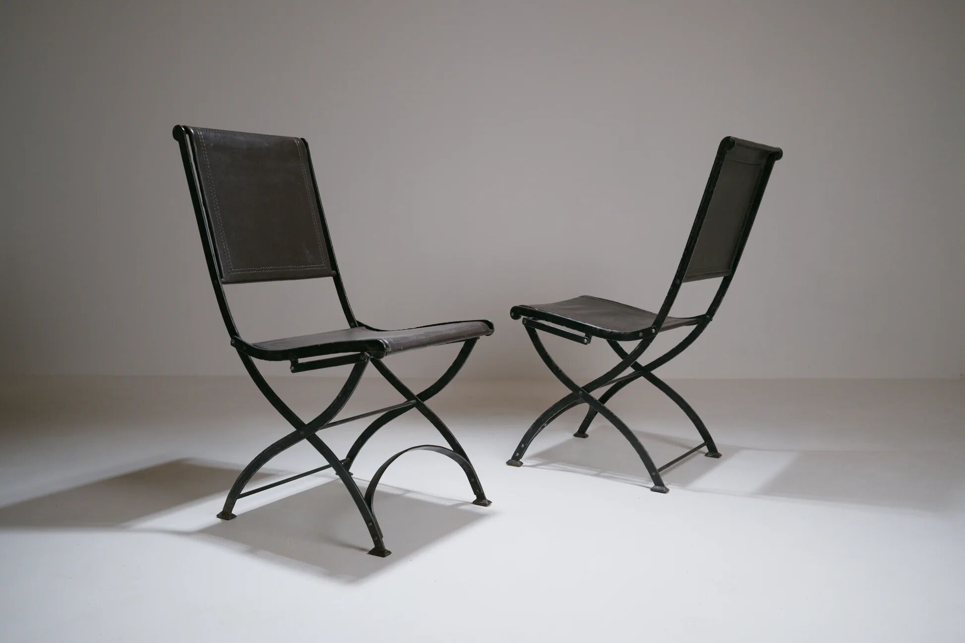 Foldable chair in wrought iron and leather. c. 1950