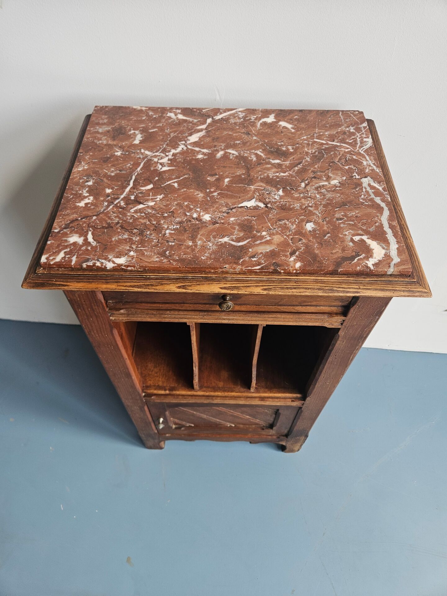 Wooden bedside table with book storage