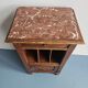 Wooden bedside table with book storage