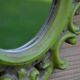 Small green wooden mirror