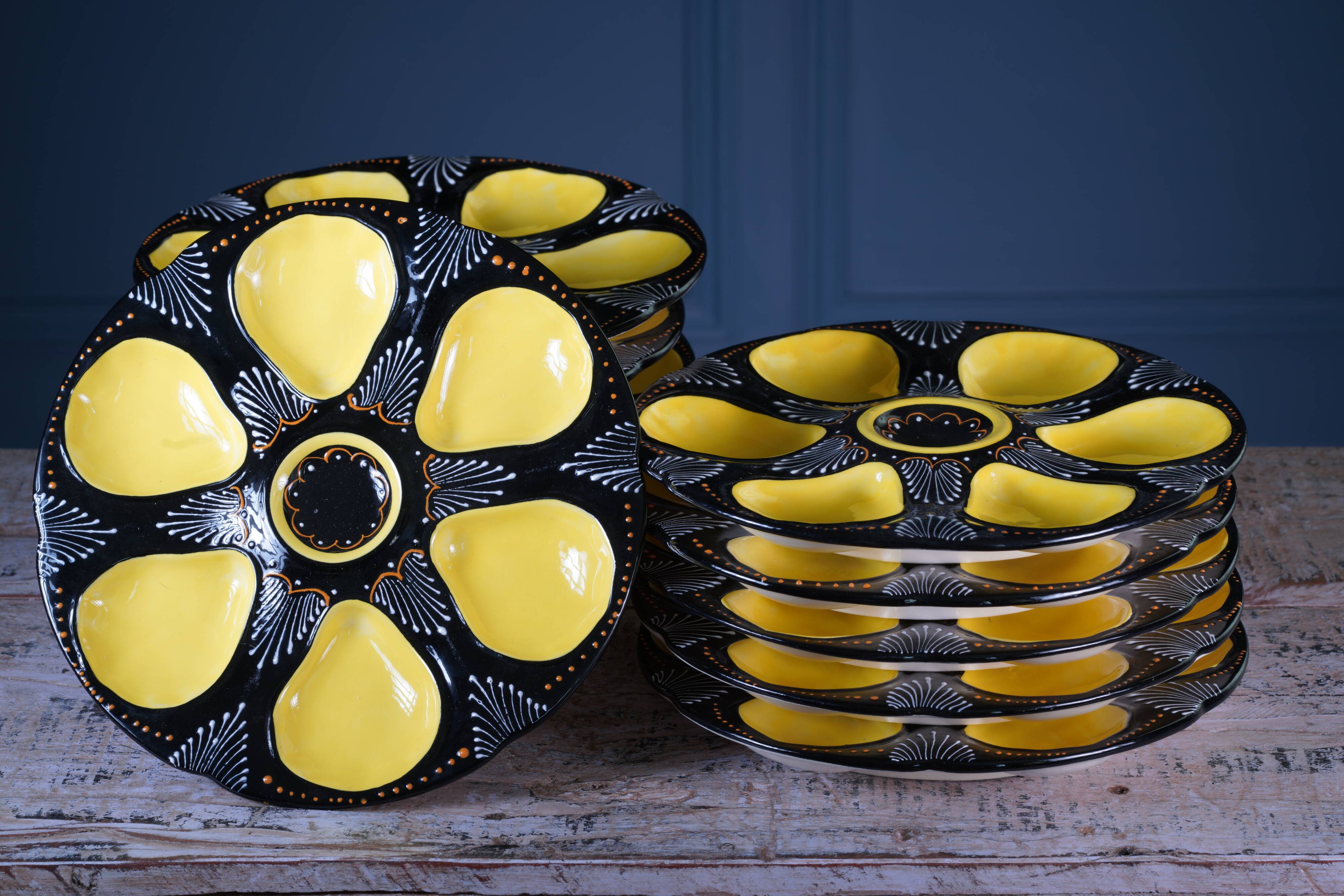 Set of twelve handpainted Brittany yellow, cream and black oyster plates