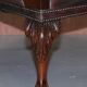 Gainsborough armchair George II leather Chesterfield hand-carved with claw and ball feet.