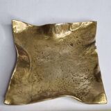 Empty pocket in polished brass representing a crumpled paper, signed CJ, 11.5 cm