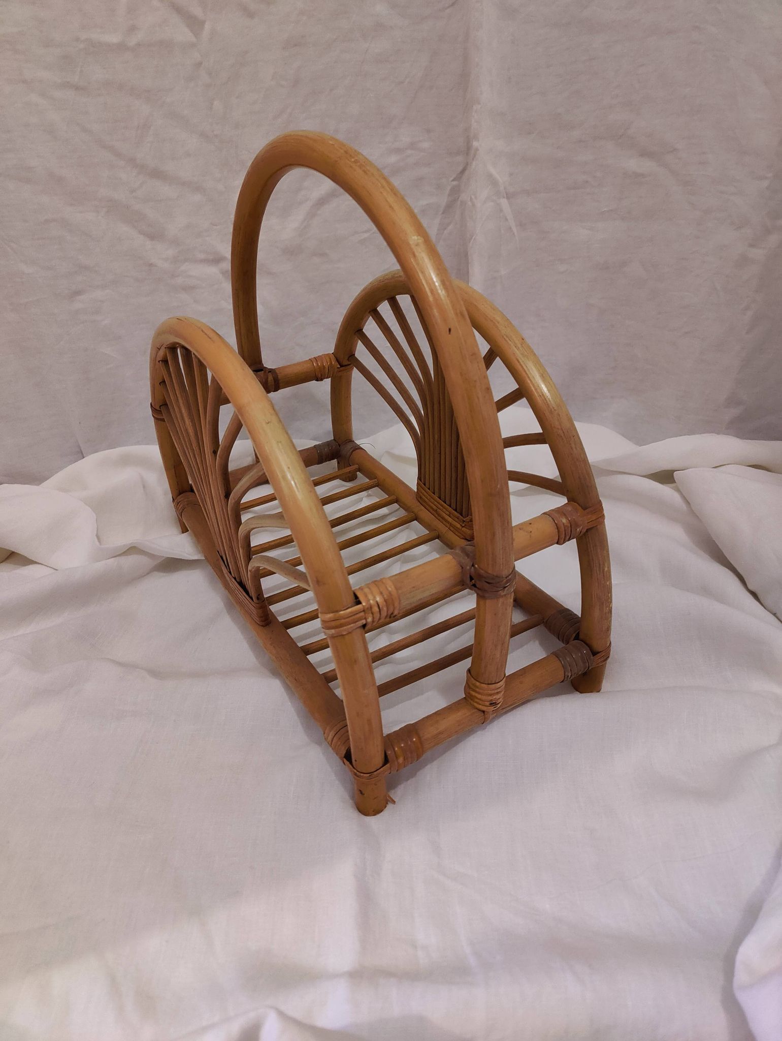 Woven bamboo magazine rack from the 1970s