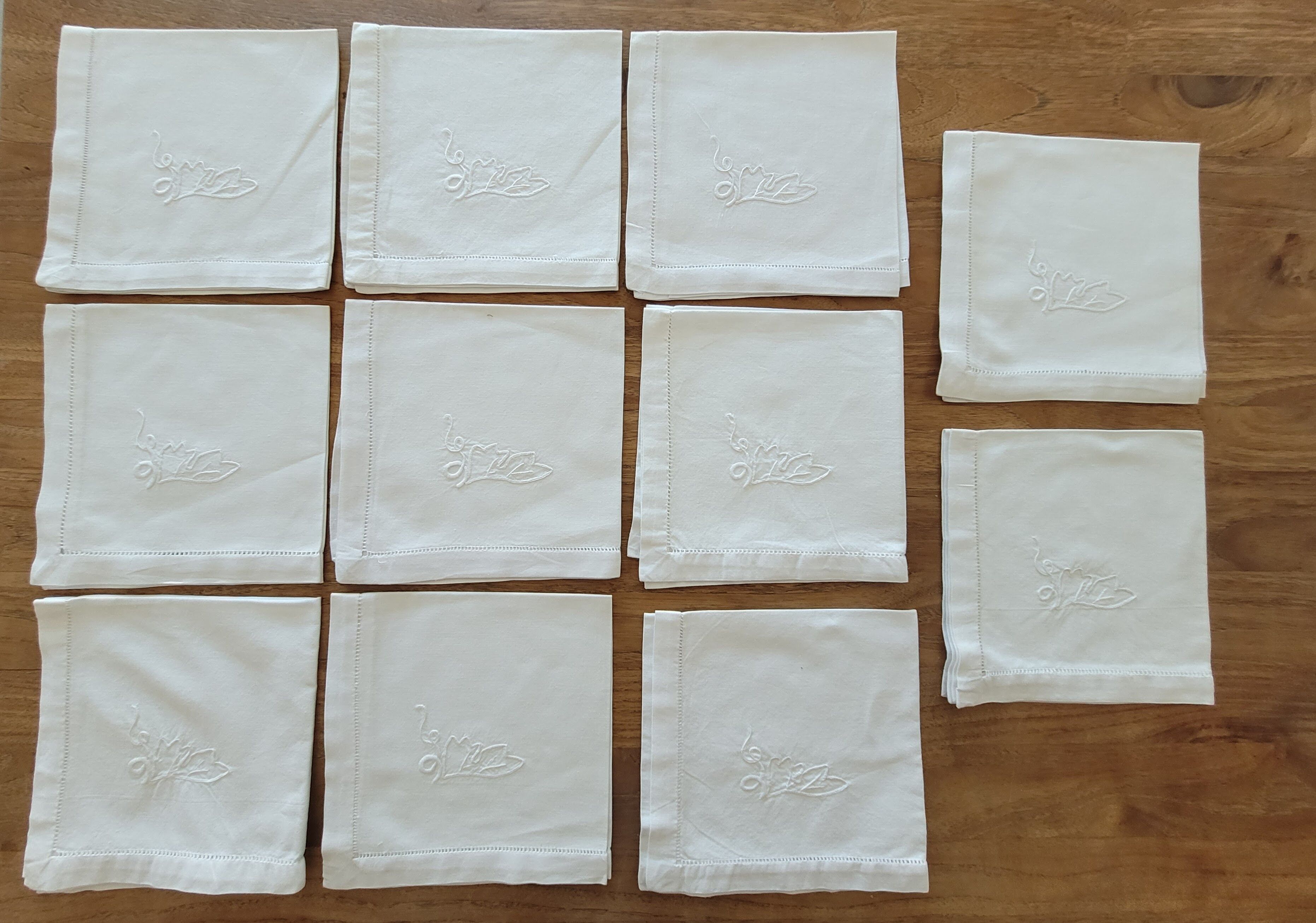 11 white embroidered towels