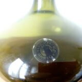 Small dark green handmade glass ball vase