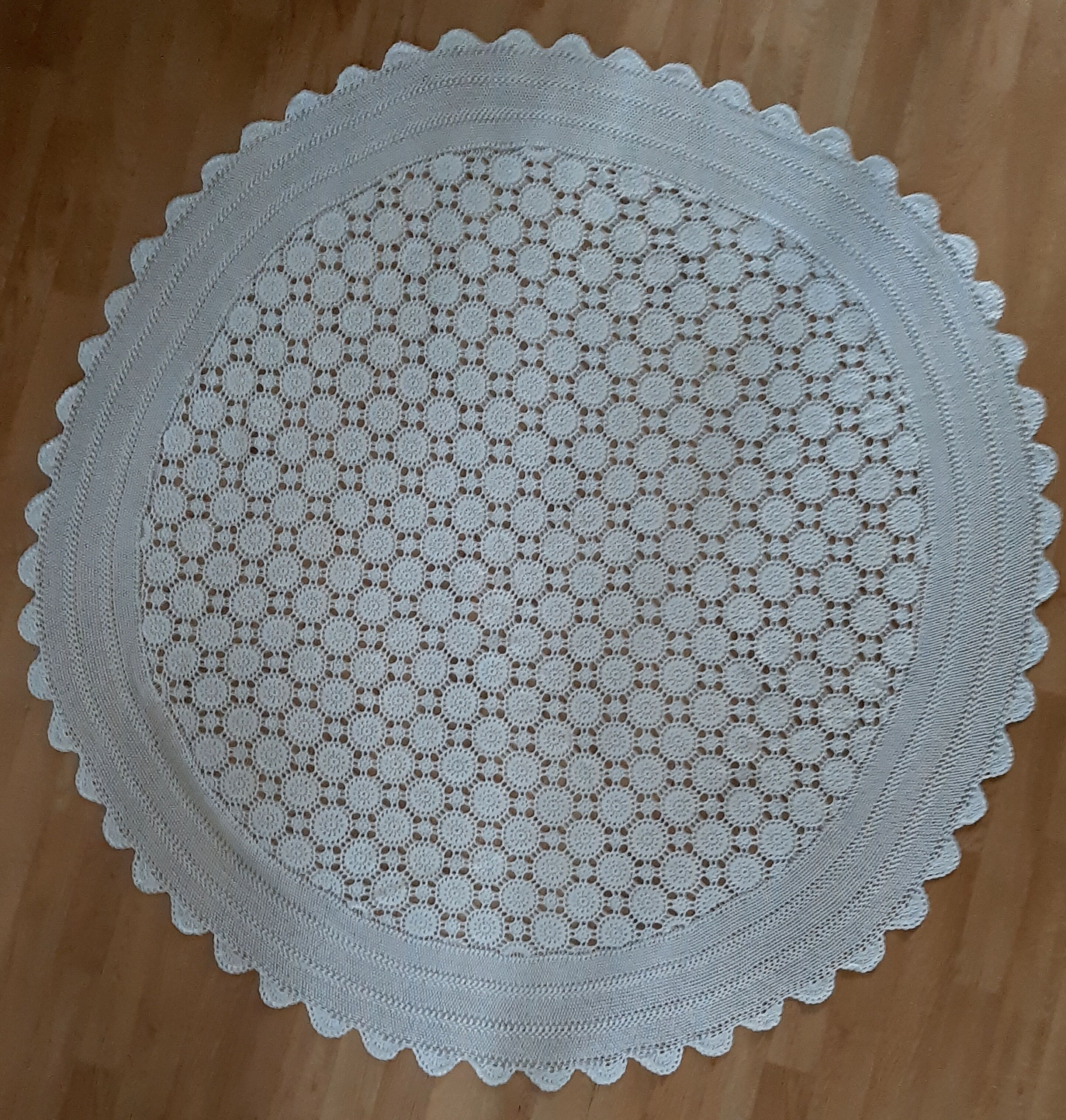 Old crocheted round tablecloth