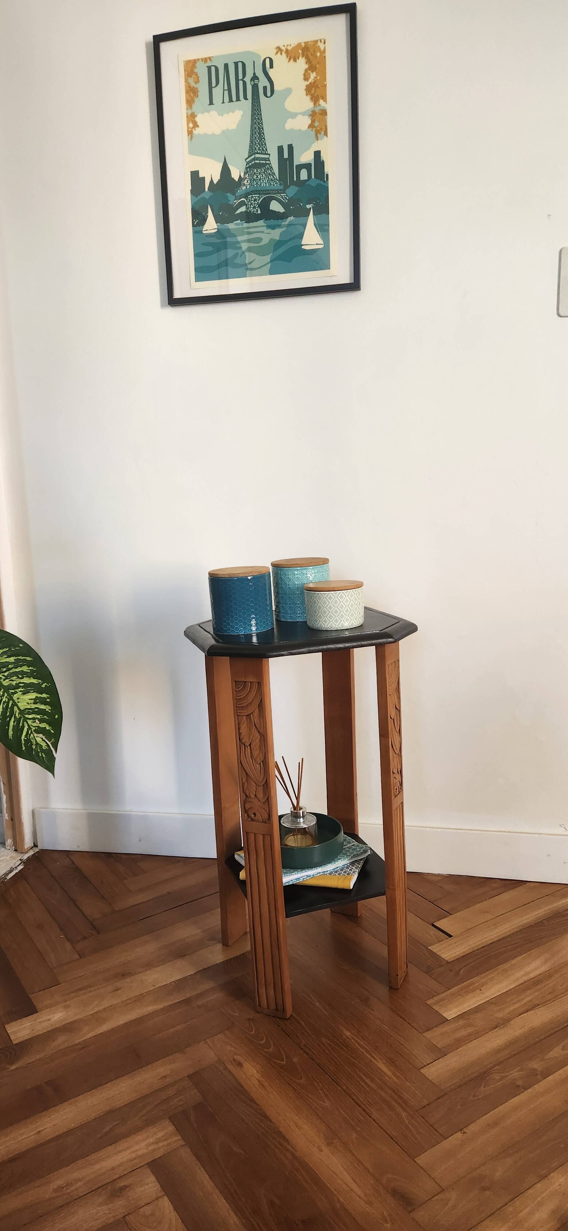 Art Deco console with sculpted black lacquered legs.