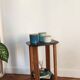 Art Deco console with sculpted black lacquered legs.