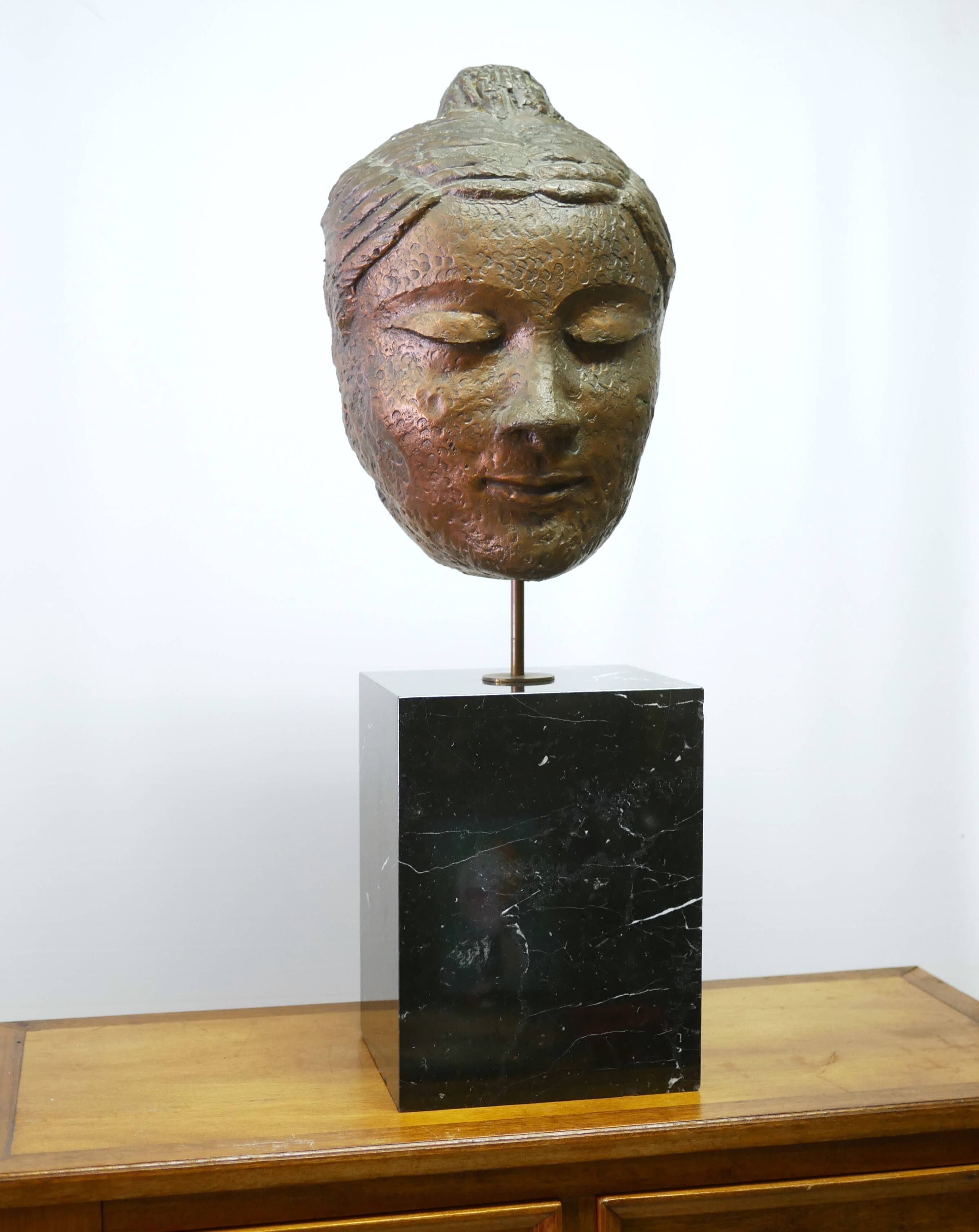 Buddha head sculpture, marble base