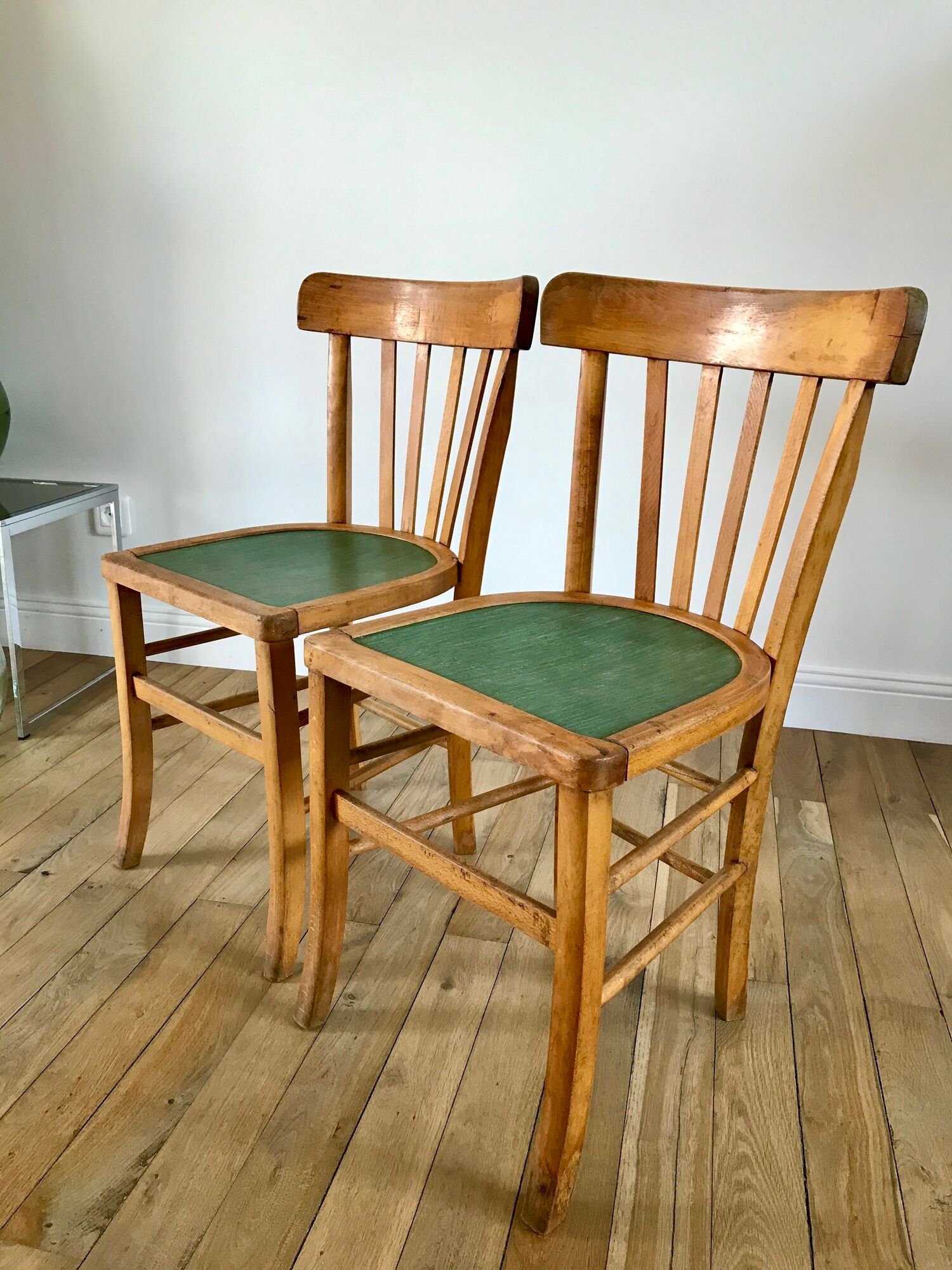 Pair of bistro chairs in light curved wood and green seat 1950s