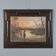 Ancient painting of an exotic landscape with pyramids and figures from the 1800s.