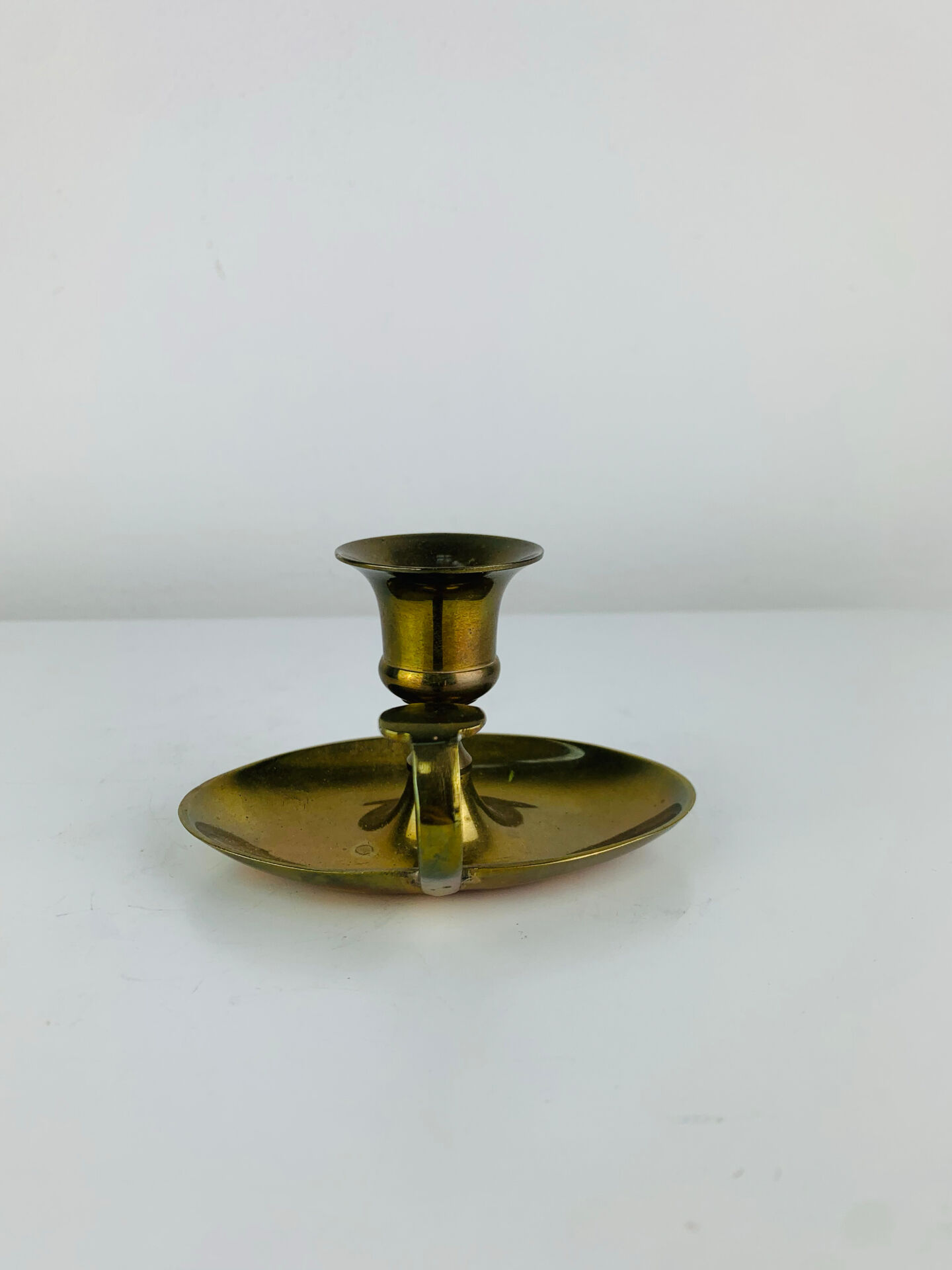 Vintage brass candlestick, rat of the cellar.