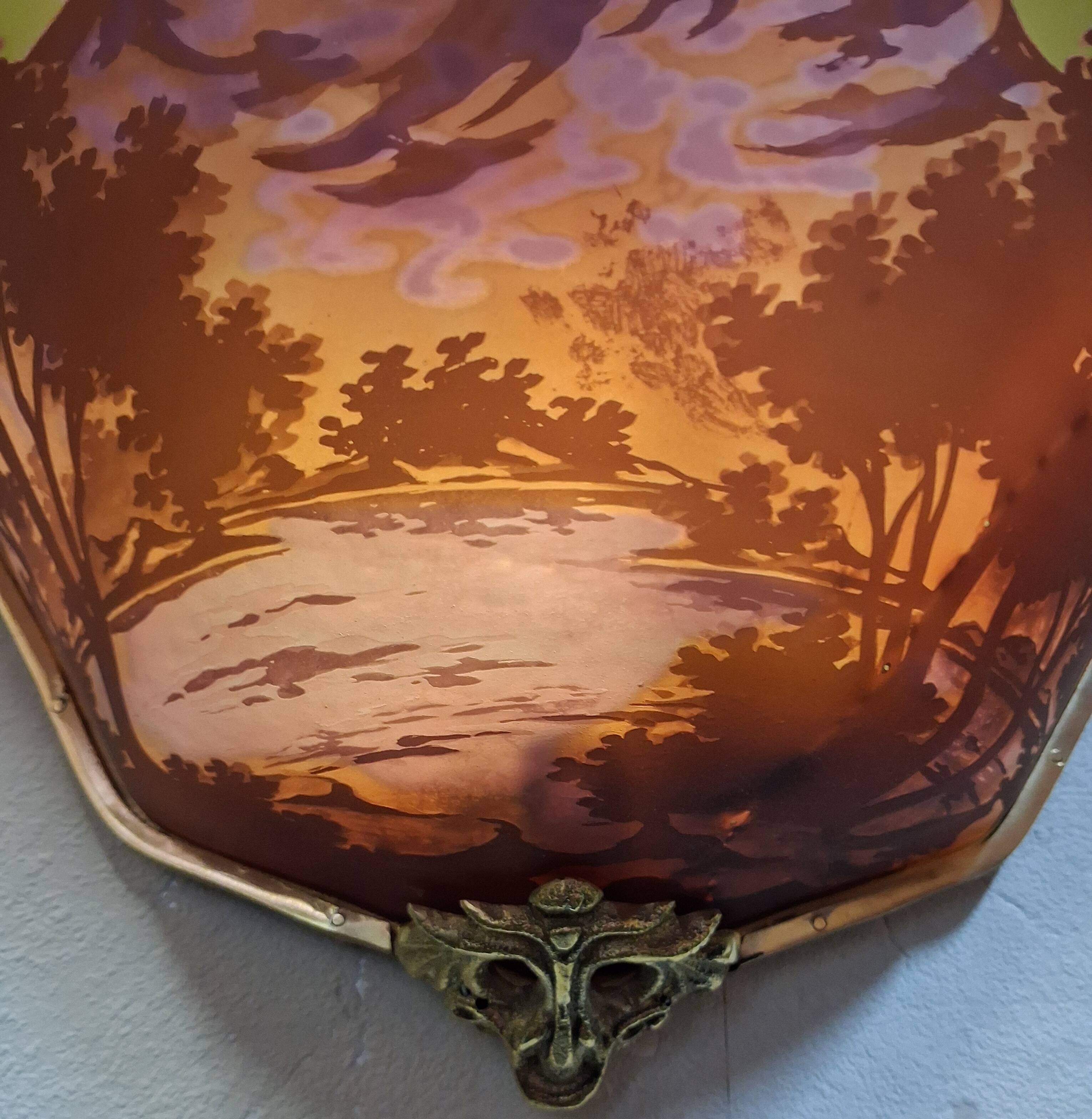 Pair of decorative wall sconces in Art Nouveau style.