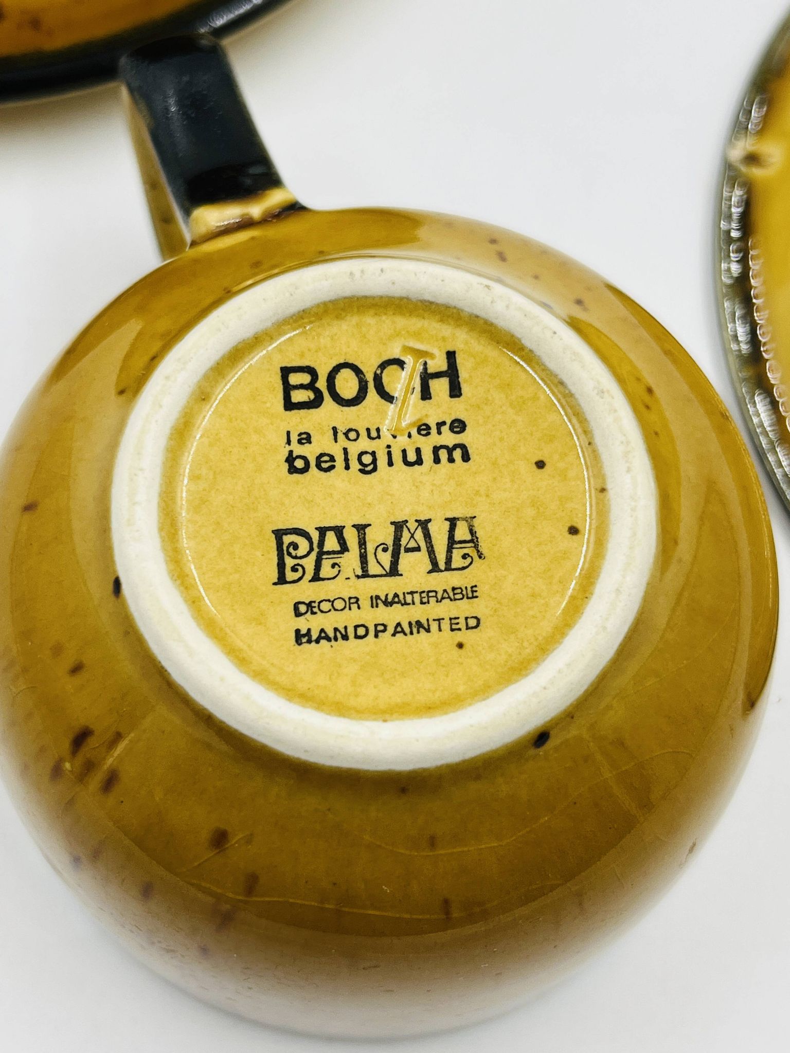Set of four vintage Boch Palma cups and saucers.