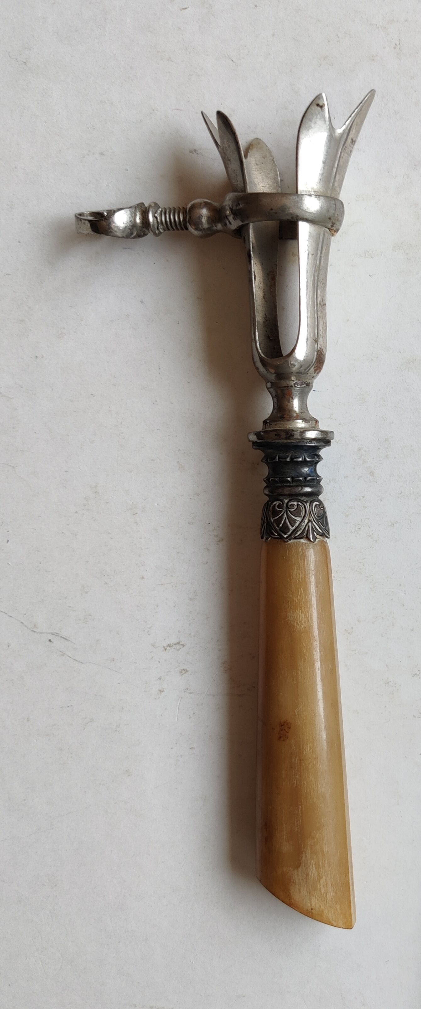 Horn and silver metal leg of lamb tong handle