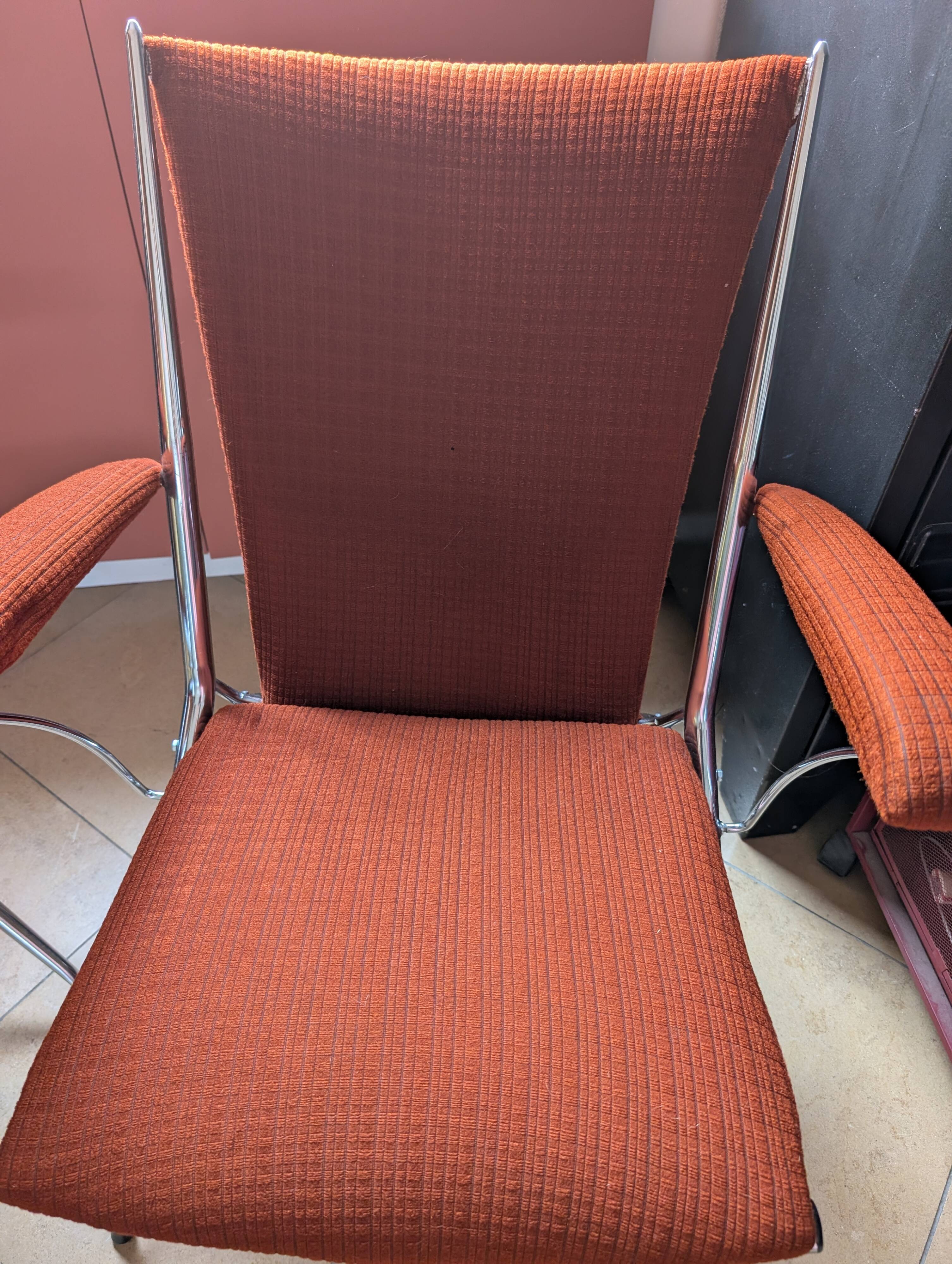 Pair of vintage folding chairs in terracotta fabric.