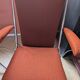 Pair of vintage folding chairs in terracotta fabric.